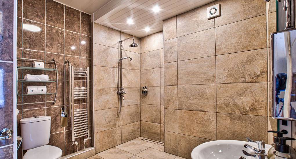 Wet room bathroom with open shower