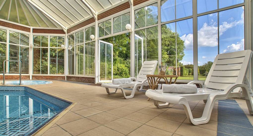 Sun loungers next to the swimming pool