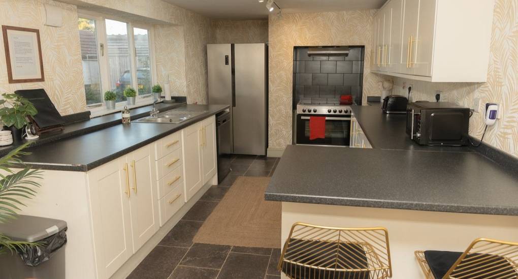 Breakfast bar in white kitchen