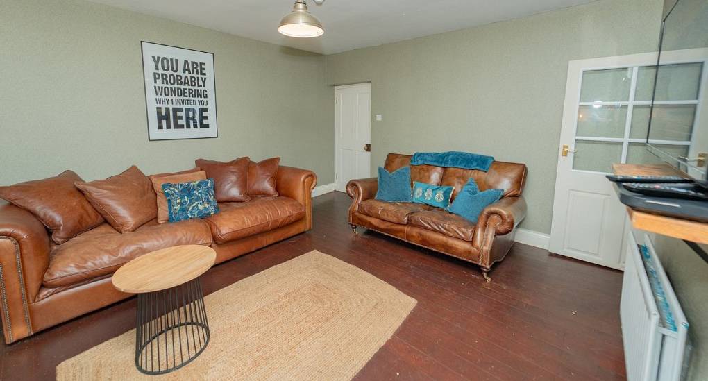 Lounge with brown leather sofas