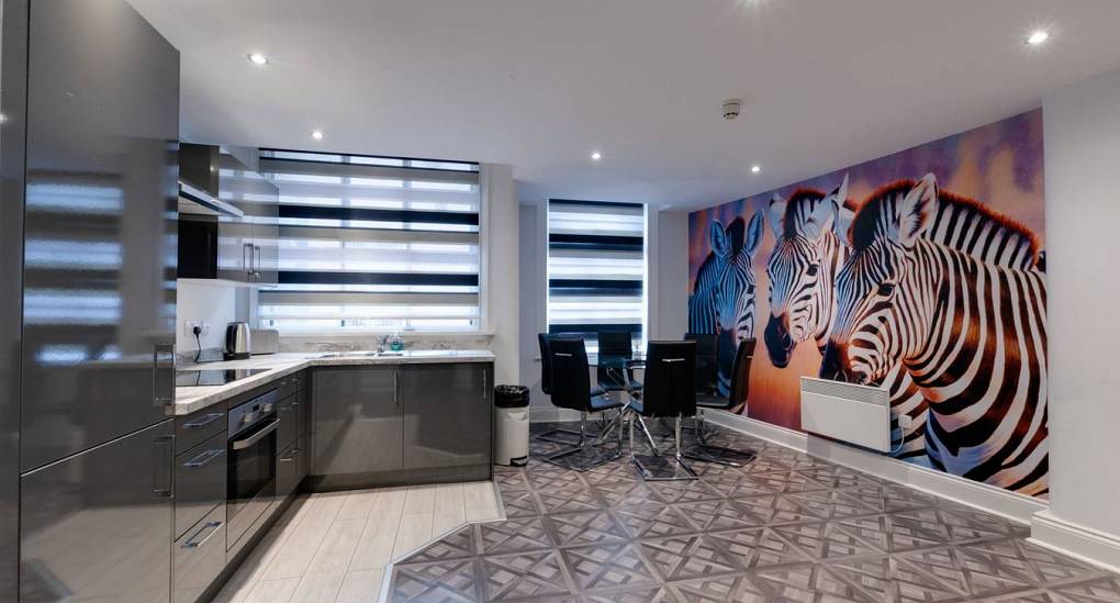 Hen accommodation open plan kitchen with zebra wall art