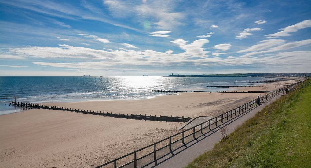 Panoramic view of Aberdeen beach coastline and promenade on a bright sunny day for an unforgettable aberdeen stag do.