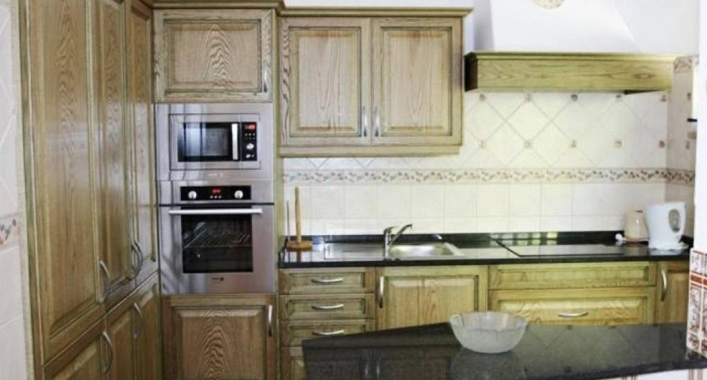 Villa kitchen with wooden doors