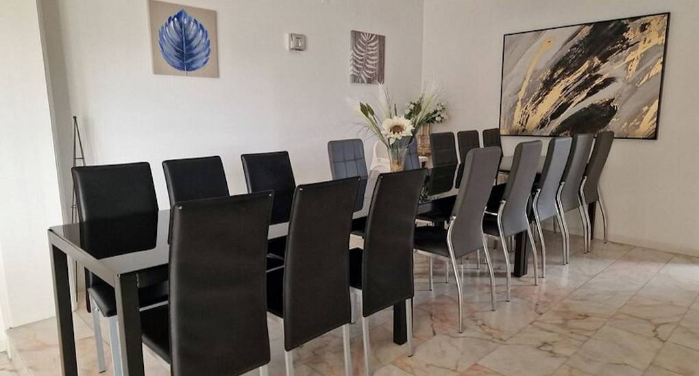 Dining room with table and chairs in villa