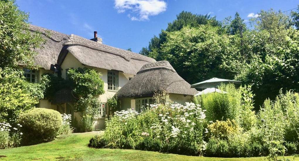 The view from outside from a different angle showing some of the large garden of the Secret Gardens hen do house