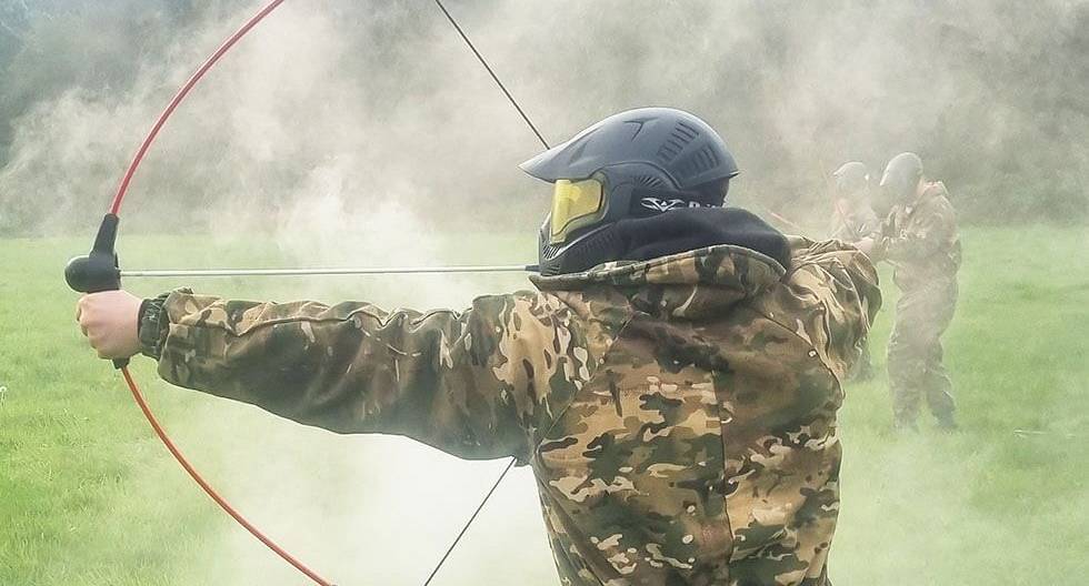 Archery Tag player in action, using smoke as cover