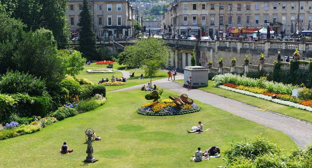 Sunny view of Parade Gardens and historic Georgian architecture in Bath, ideal setting for a stylish bath hen do.