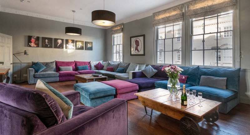 The spacious velvet sectional lounge at The Thermals, a 4-storey Georgian Bath hen party townhouse sleeping 14.