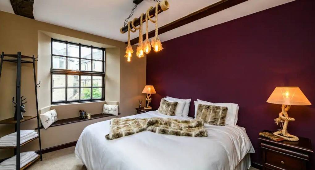 Large bedroom with king size bed made up ready for guests 