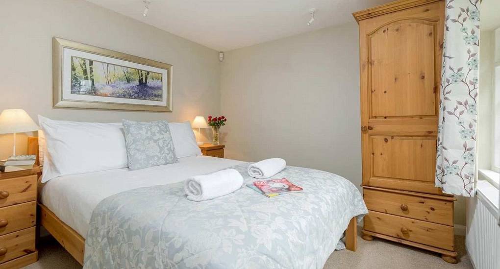 Bedroom with double bed in the Secret Garden, New Forest Stag do accommodation