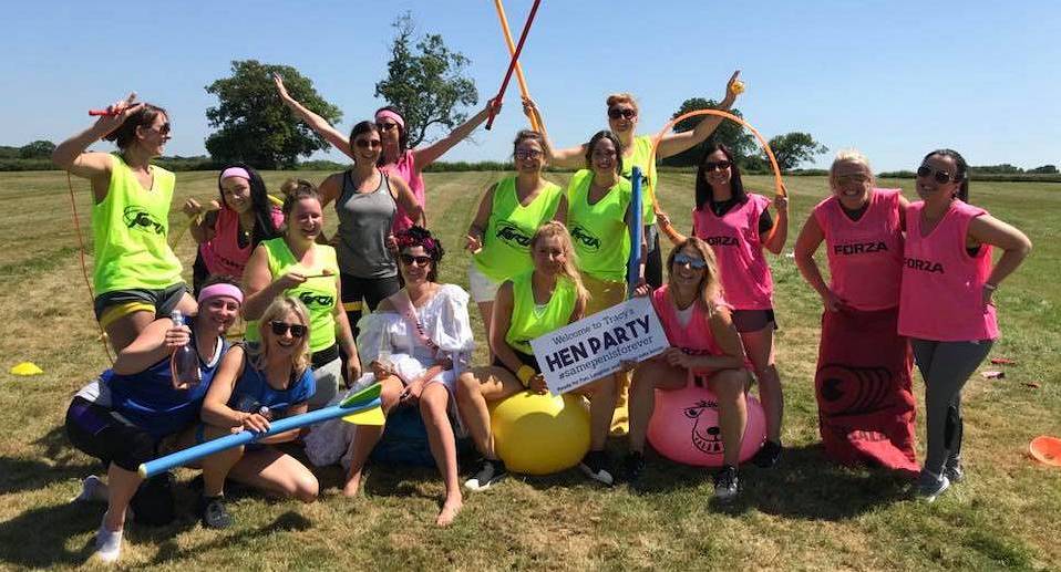 Hen party enjoying Old School Sports day pose for pic