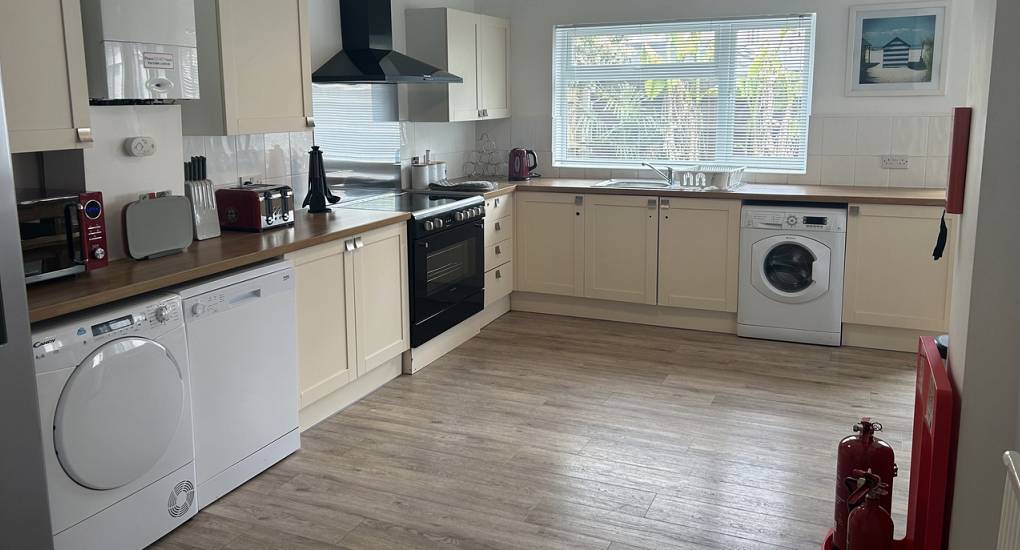 The kitchen area of the Charming House