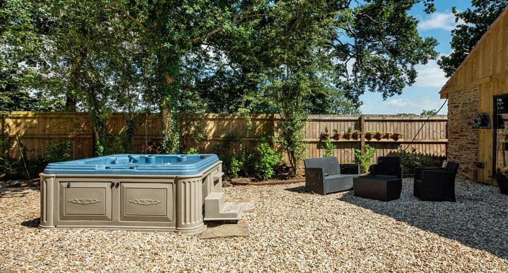 Hot tub view in the garden with seating