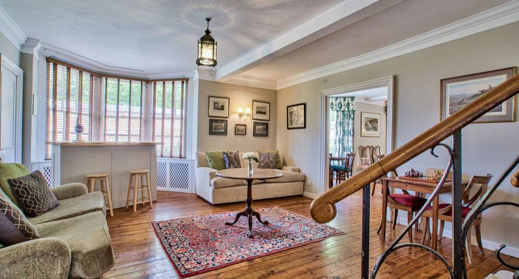 Open plan hallway with party bar near stairs