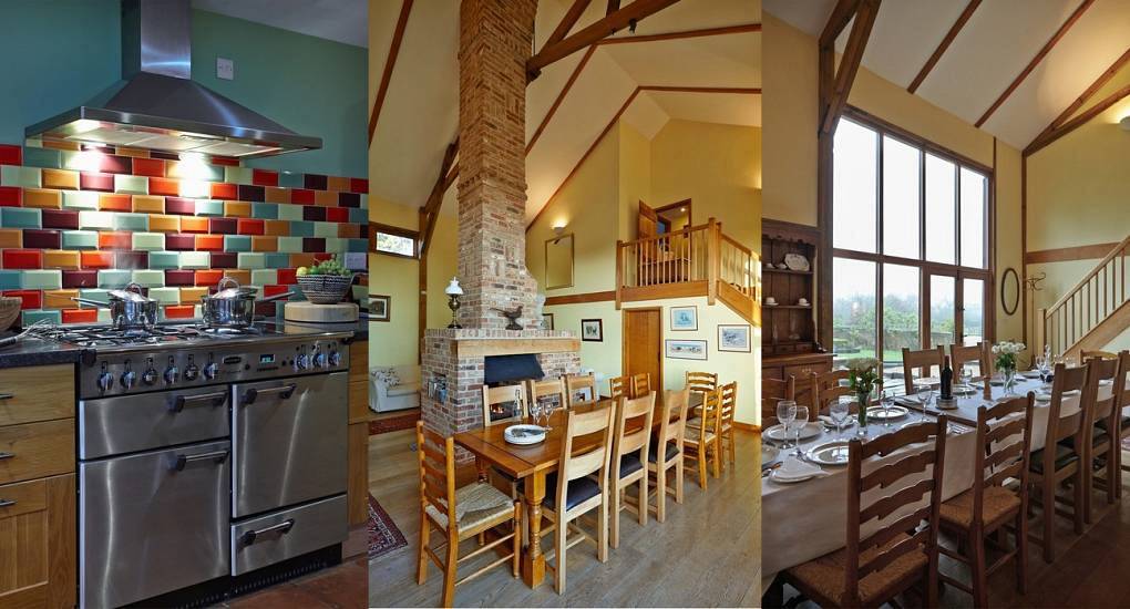 Double-height dining room with brick fireplace and colourful kitchen at The Barn near Cambridge.