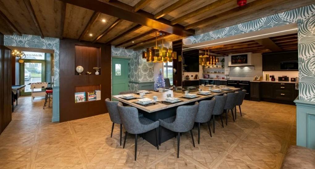 Open plan ground floor with dining area, lounge area and games room in view