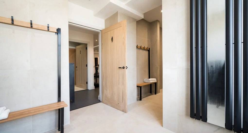Changing facilities with individual rooms, towel rails and lockers