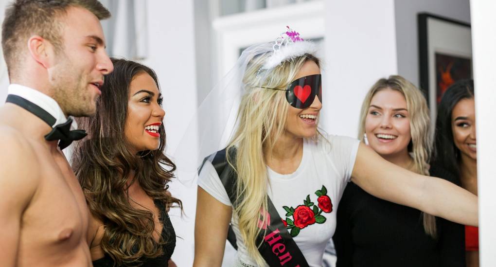 Bride to be playing a classic hen party game with a Cheeky Butler