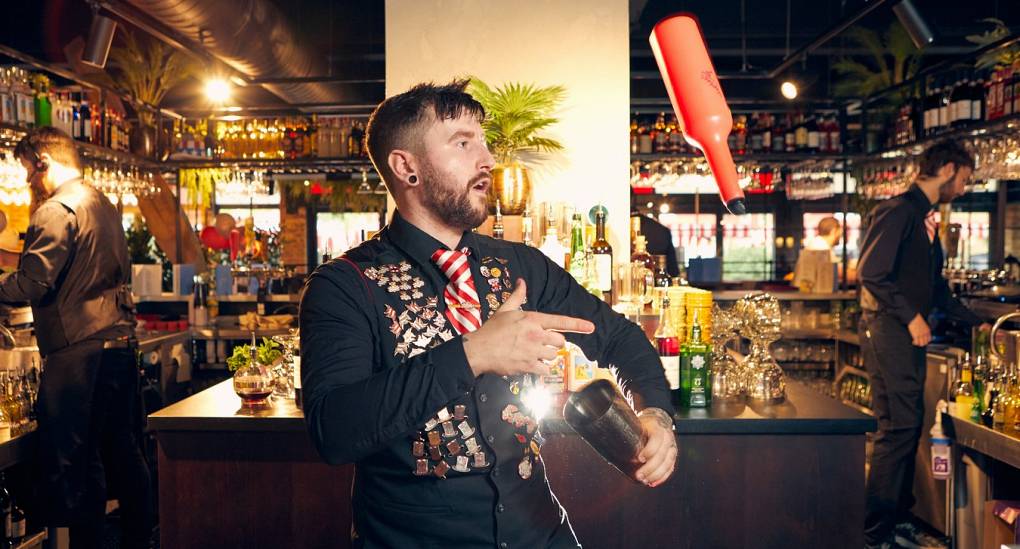 Barman showing cocktail making skills