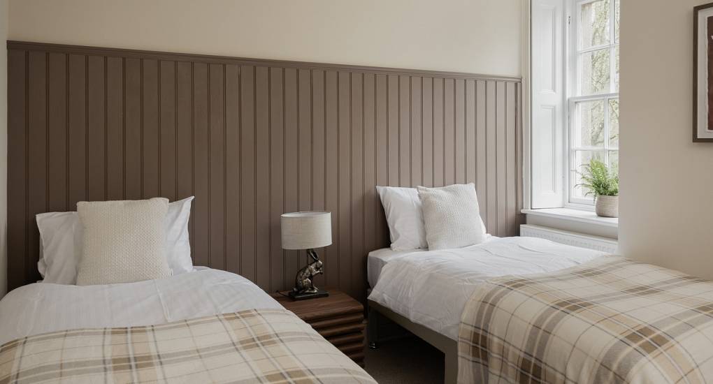 Twin beds in cream and brown decorated bedroom