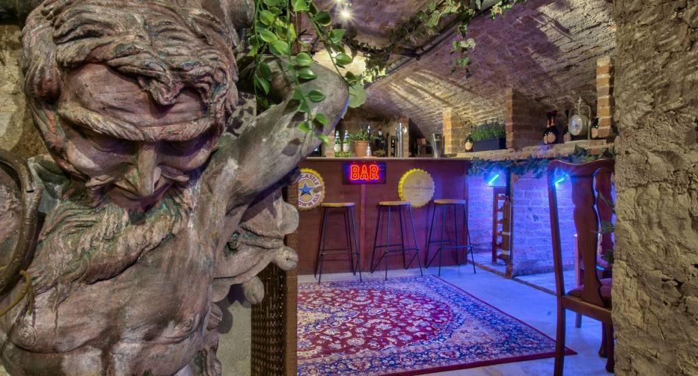 The private basement bar at Country Fortress, a luxury Newcastle hen party house featuring a unique gothic-style social area.
