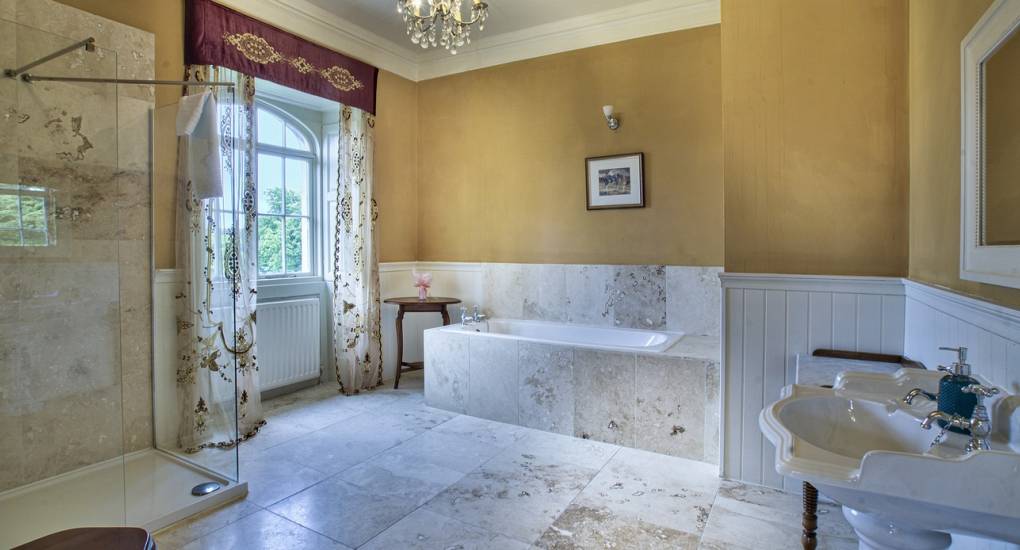 A second luxury bathroom at Country Fortress, featuring a modern walk-in shower for large group hen weekend stays.