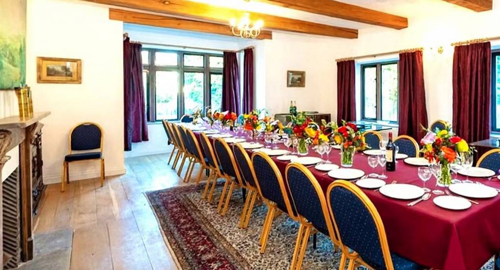 Dining area with large table at the Monmouth Manor hen weekend accommodation