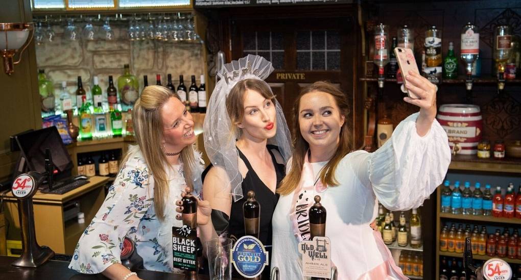 Hen party behind the bar at the Woolpack enjoying the Emmerdale Studio Experience