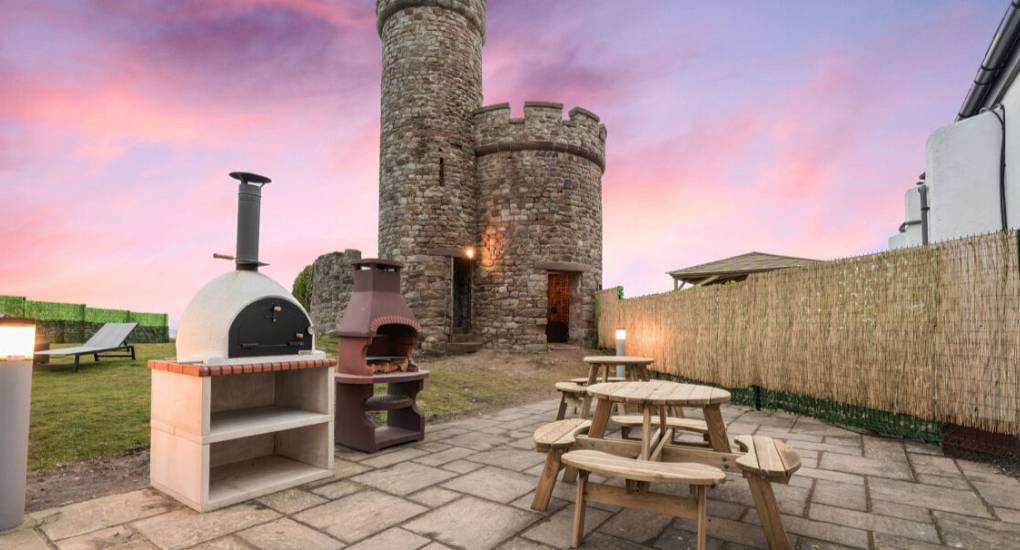 Garden area with BBQ, Firepit and watch tower in the background