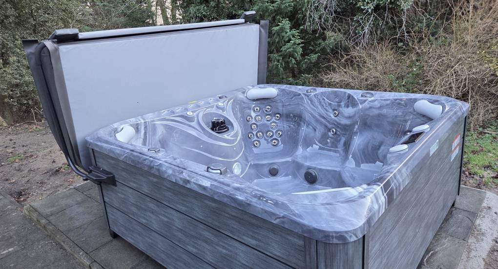Large private hot tub at Geordie Getaway, a luxury Newcastle hen party house with hot tub for group weekends.