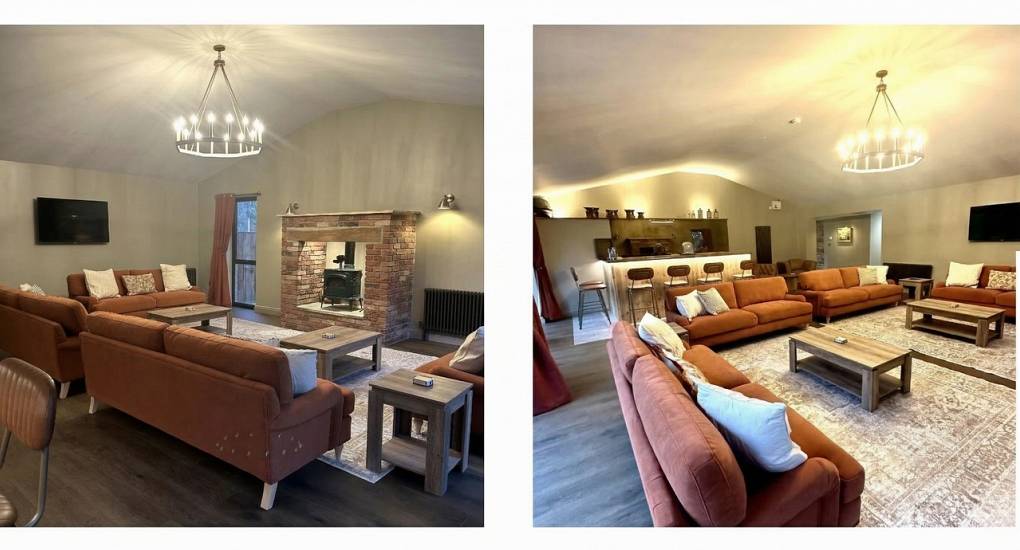 Cosy dual-angle view of the lounge and feature fireplace at Geordie Getaway, a luxury Newcastle party house for large groups.