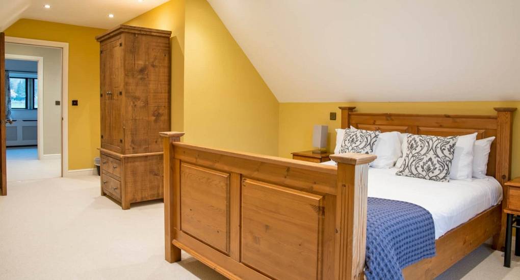 Spacious master bedroom at Godfrey Manor, a luxury 10-bedroom hen party house in the Peak District.