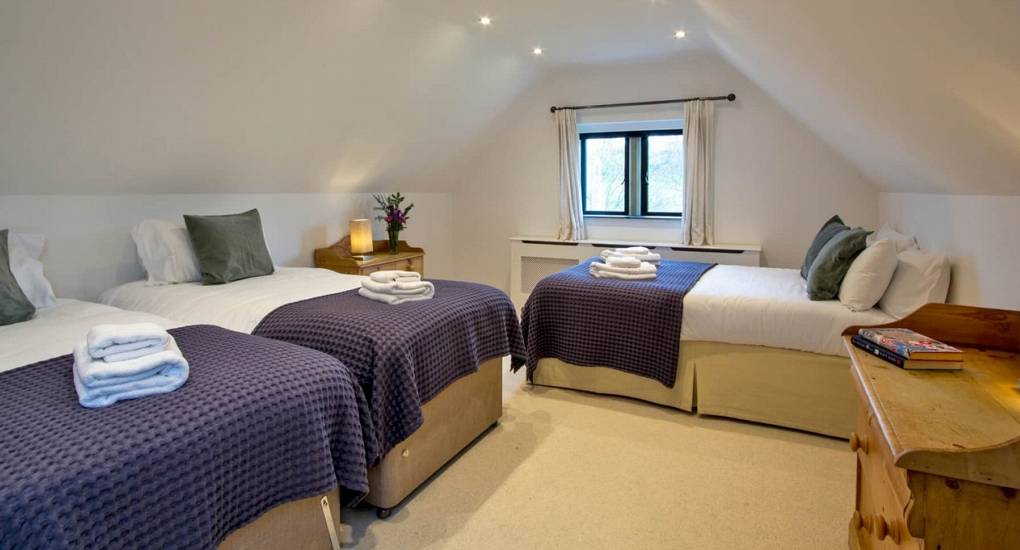 Triple bedroom configuration at Godfrey Manor to accommodate large hen groups visiting the Peak District.