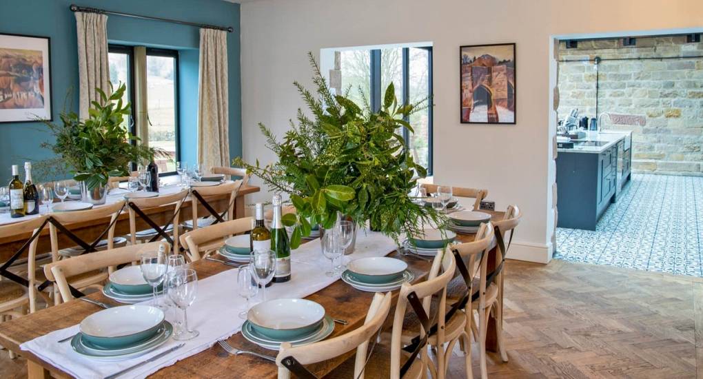 Large communal dining area at Godfrey Manor, a luxury Peak District hen party house designed for group meals and celebrations.