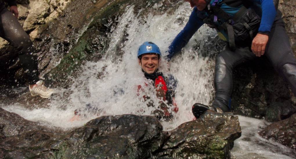 Stag making a splash and enjoying the Gorge Scrambling activity