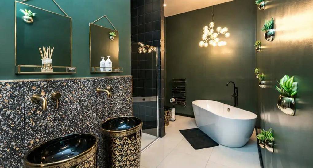 Stylish modern bathroom with gold and black colour scheme