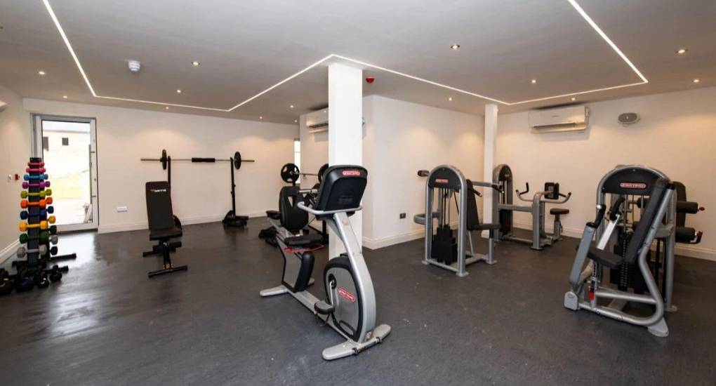 Gym area featuring various exercise machines