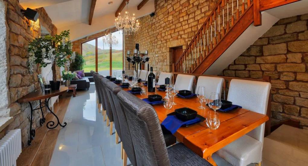Close up view across the large dining table set up for 20 guests