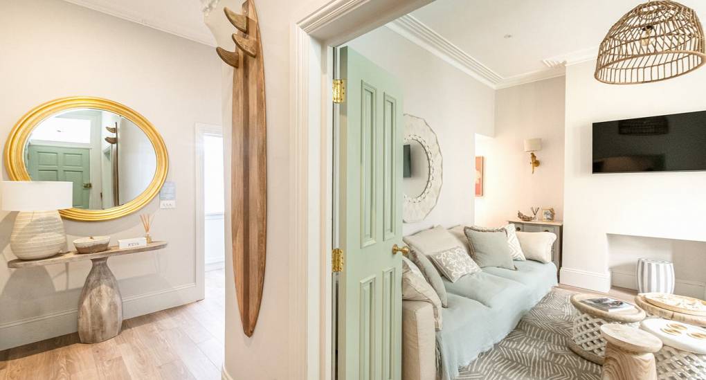 Luxury Bournemouth hen party house interior: The stylish hallway and lounge at The Drift, perfectly located for a beach weekend.