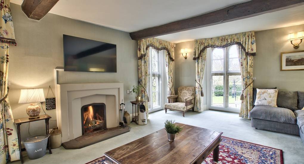 Fire place and TV lounge with sofas