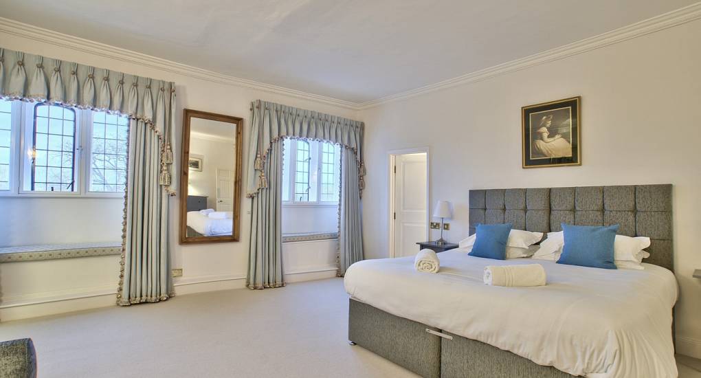 Two large windows in double bedroom