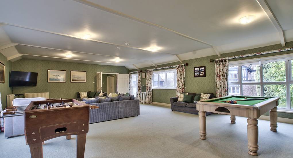 Table football and pool table in large games room 