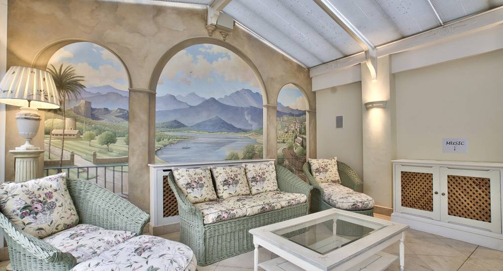 Snug sofa space near the swimming pool