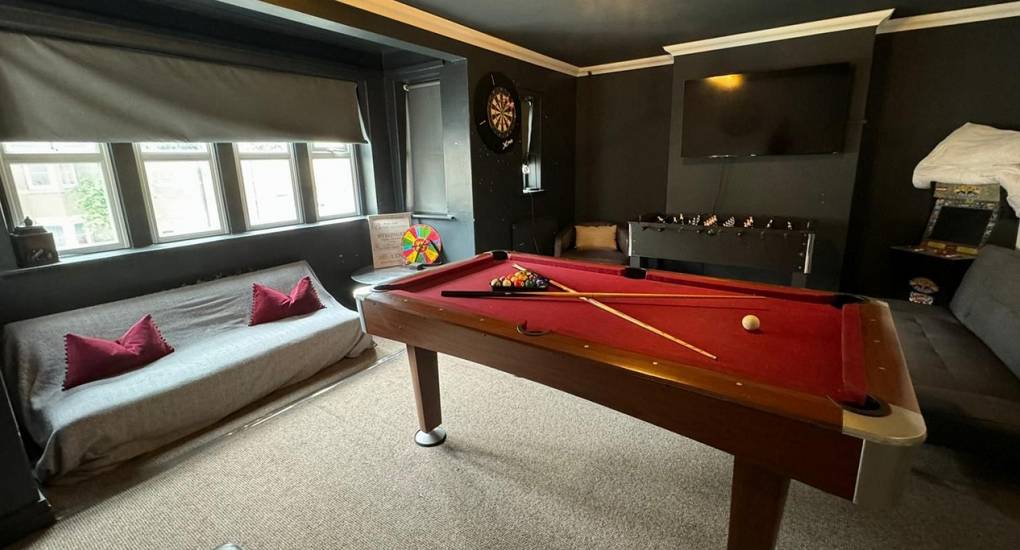 Games room with pool table and TV