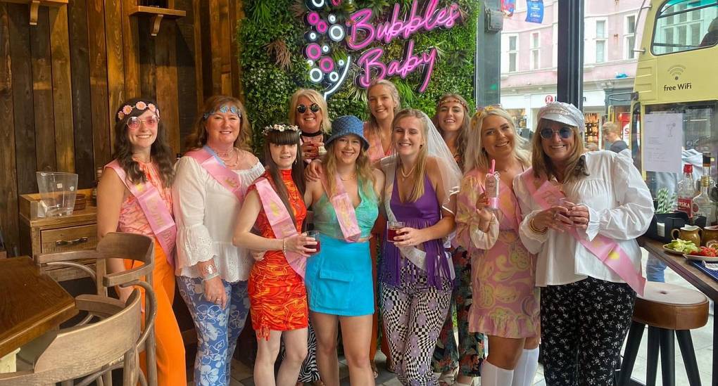 Hen party pose for pic in a bar