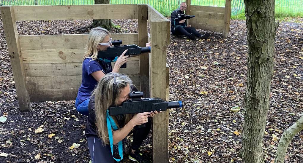 Two hens doing laser tag