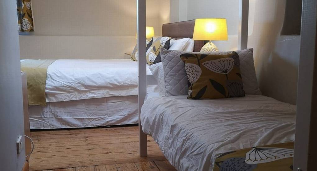 view of bottom bunk and double bed