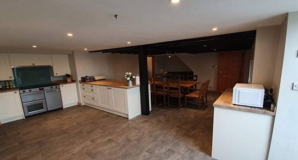 big open plan kitchen with dining table