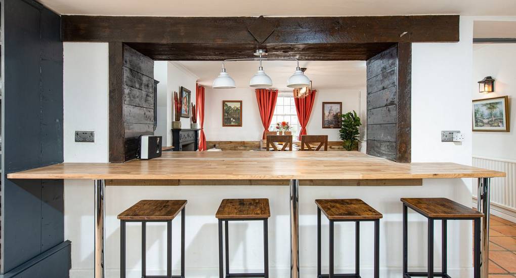 Breakfast bar with stools in kitchen