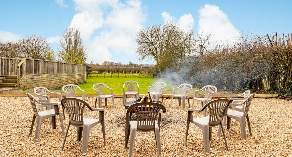 Arranged seating around fire pit in the garden